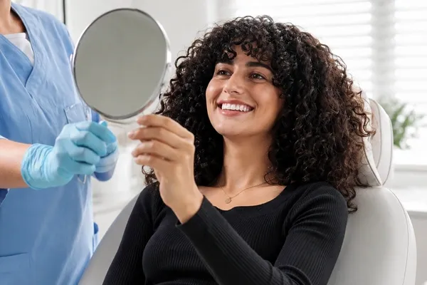 Patient smiling after bone and tissue regeneration treatment